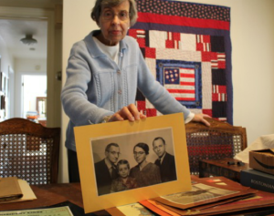 Edith Schafer with a family photo. Photo by Ellie Malone and Sarah DeGeorge.