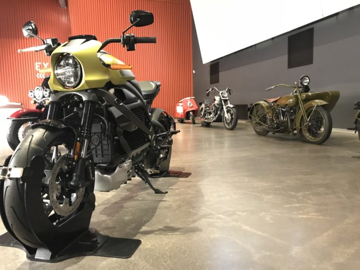 Harley-Davidson LiveWire in green with older motorcycles in background