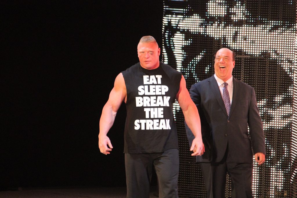 Brock Lesnar and Paul Heyman a day after beating the Undertaker in Wrestlemania XXX. Lesnar is wearing a shirt that says "EAT. SLEEP. BREAK THE STREAK."