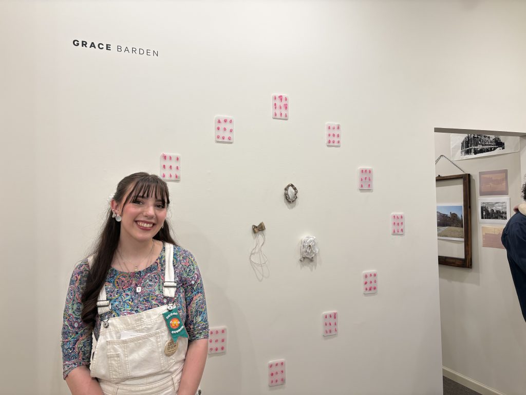 Barden poses with her work. 