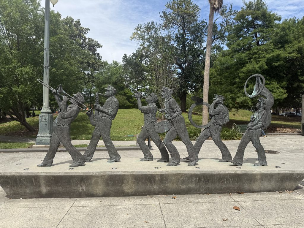 The New Orleans Brass Band located in the Roots of Music Cultural Sculpture Garden located in Congo Square