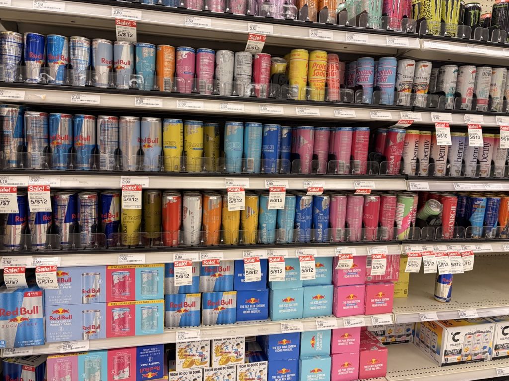 A collection of different energy drinks on the shelves at Target. 
